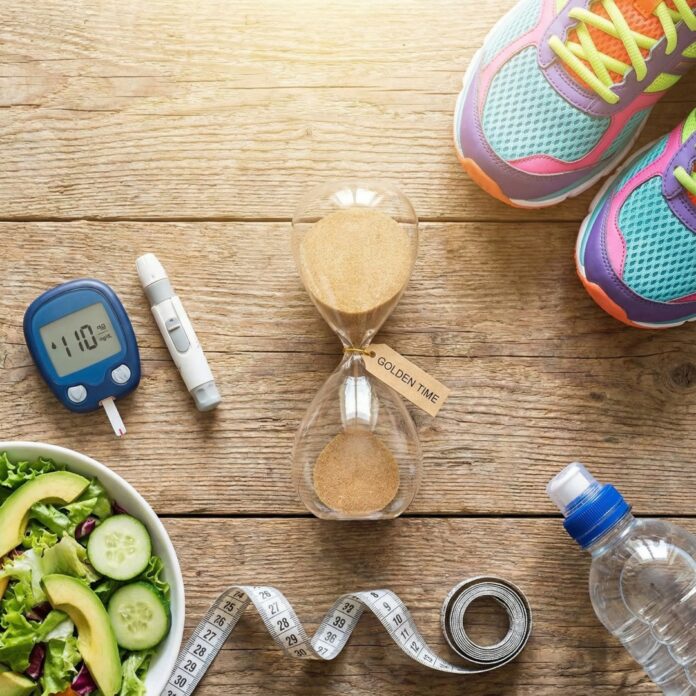혈당 측정기와 모래시계, 건강한 식단이 놓인 모습, 당뇨 전단계 관리와 골든타임의 중요성을 상징하는 이미지